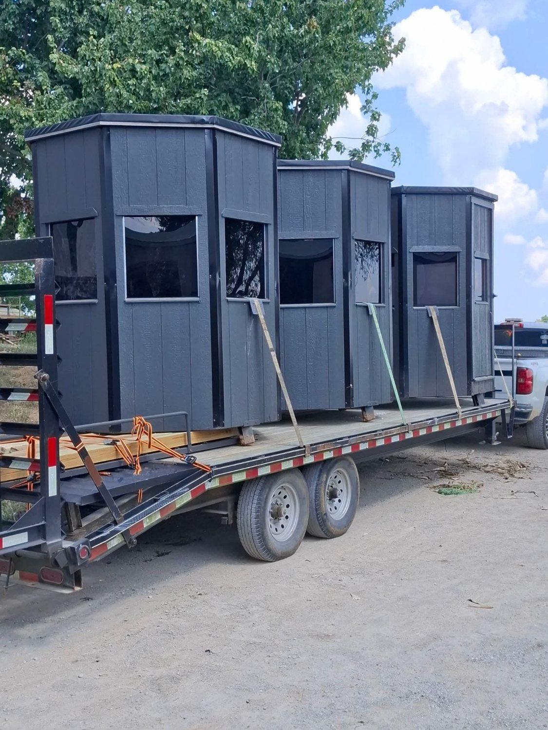 Shooting houses ready for delivery on a trailer